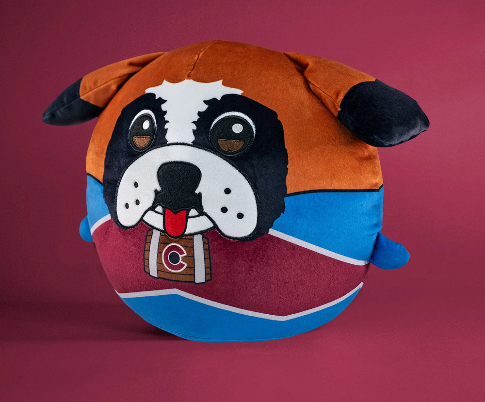 A round, plush novelty pillow featuring the face of the Colorado Avalanche mascot, Bernie the St. Bernard, wearing a team-branded barrel collar against a solid dark red background.