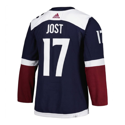 Colorado Avalanche navy blue hockey jersey shown from the back, featuring white and burgundy accents, and Jost name with number 17 on the back.
