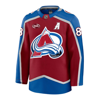 Front view of a home Colorado Avalanche hockey jersey in burgundy and blue with  silver accents, featuring the primary A-logo on the front, an burgundy and white IMA sponsorship patch on the chest, and the number 8 on the sleeves.