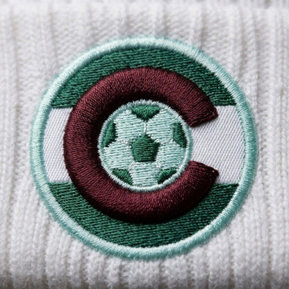 Embroidered patch with a soccer ball design on a textured white background