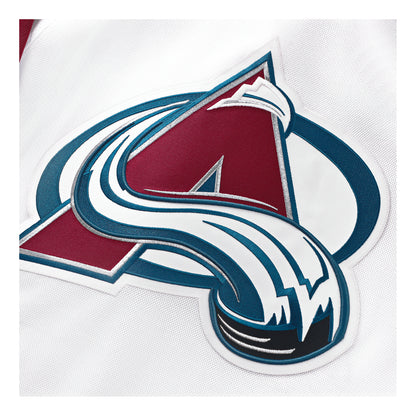 Close-up of the Colorado Avalanche embroidered Primary logo patch on a white jersey.
