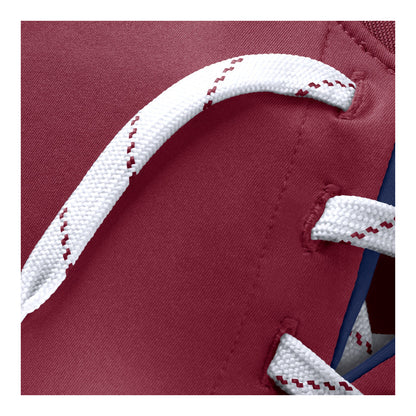 Close-up of a burgundy t-shirt with white laces featuring burgundy stitching details.