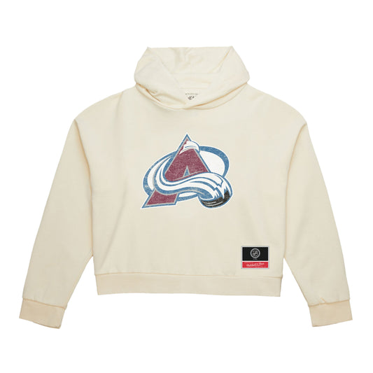 A cream-colored cropped hoodie sweatshirt featuring the Colorado Avalanche NHL logo on the chest and a small black brand patch on the lower right front.